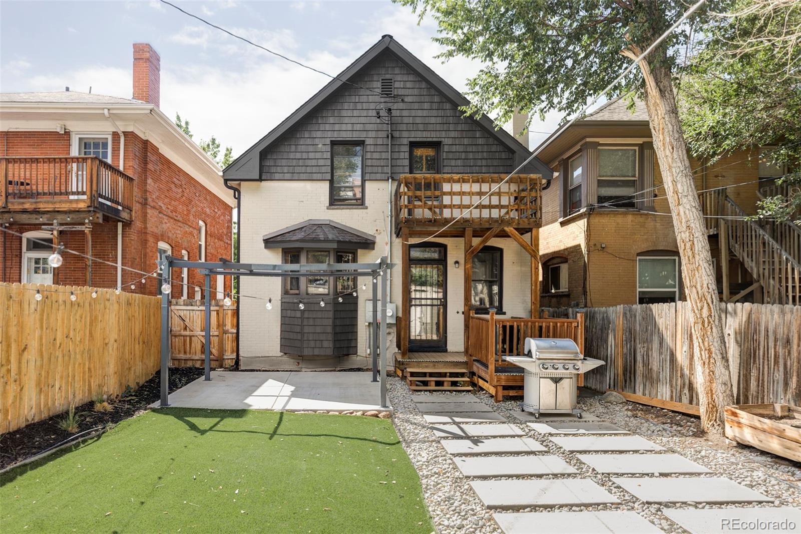 142 Logan Street Denver, CO 80203 - Photo 27 of 32 a view of a house with backyard porch and sitting area
