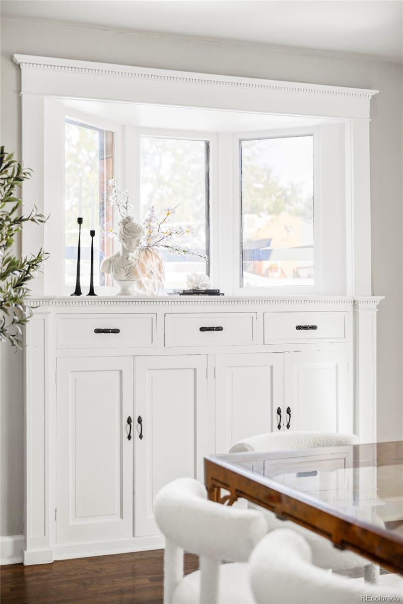 142 Logan Street Denver, CO 80203 - Photo 7 of 32 a bathroom with a granite countertop sink and a window