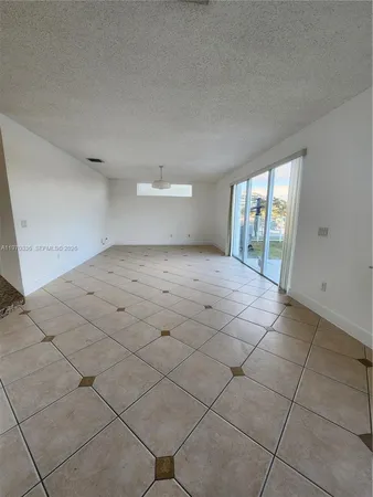 a view of an empty room and window