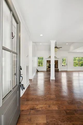 a view of an entryway with wooden floor