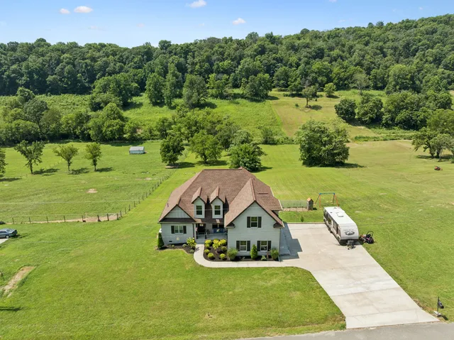 an aerial view of a house having yard
