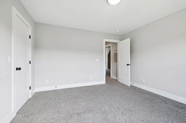 a view of balcony with wooden floor and fence