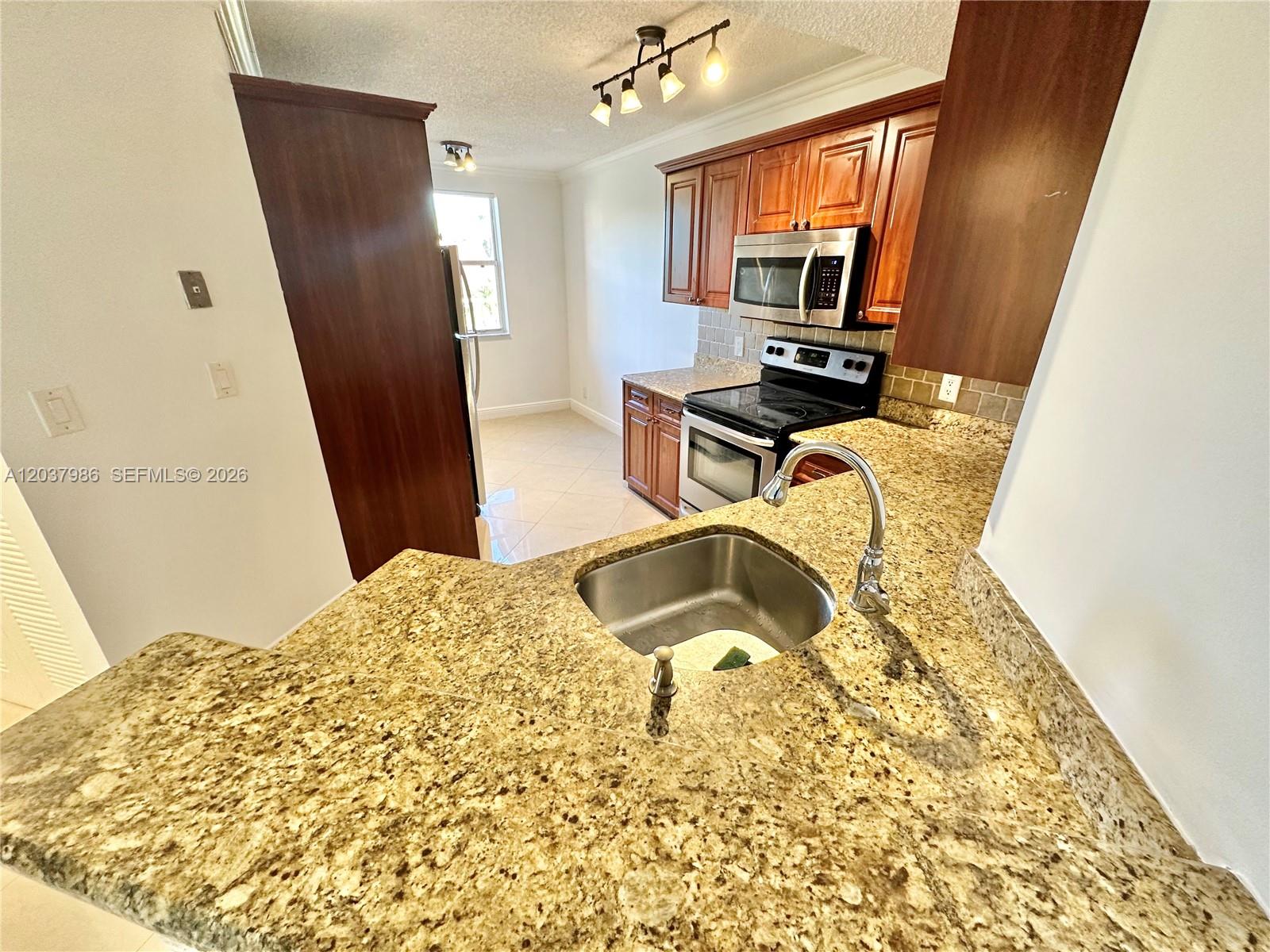 8955 Wiles Road, Unit 208 Coral Springs, FL 33067 - Photo 4 of 29
