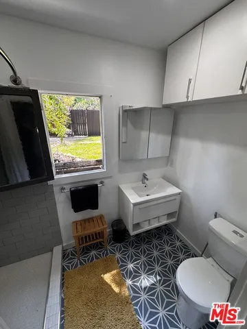 a bathroom with a sink toilet and a bathtub
