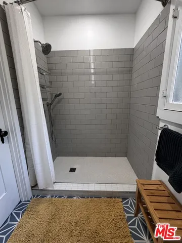 a bathroom with a sink and a shower