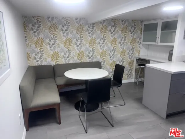 a view of a livingroom with furniture and a chair