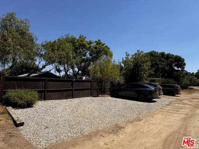 a view of wooden fence in front of house