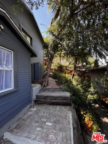 a view of house with yard
