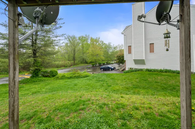 a view of a backyard with couches