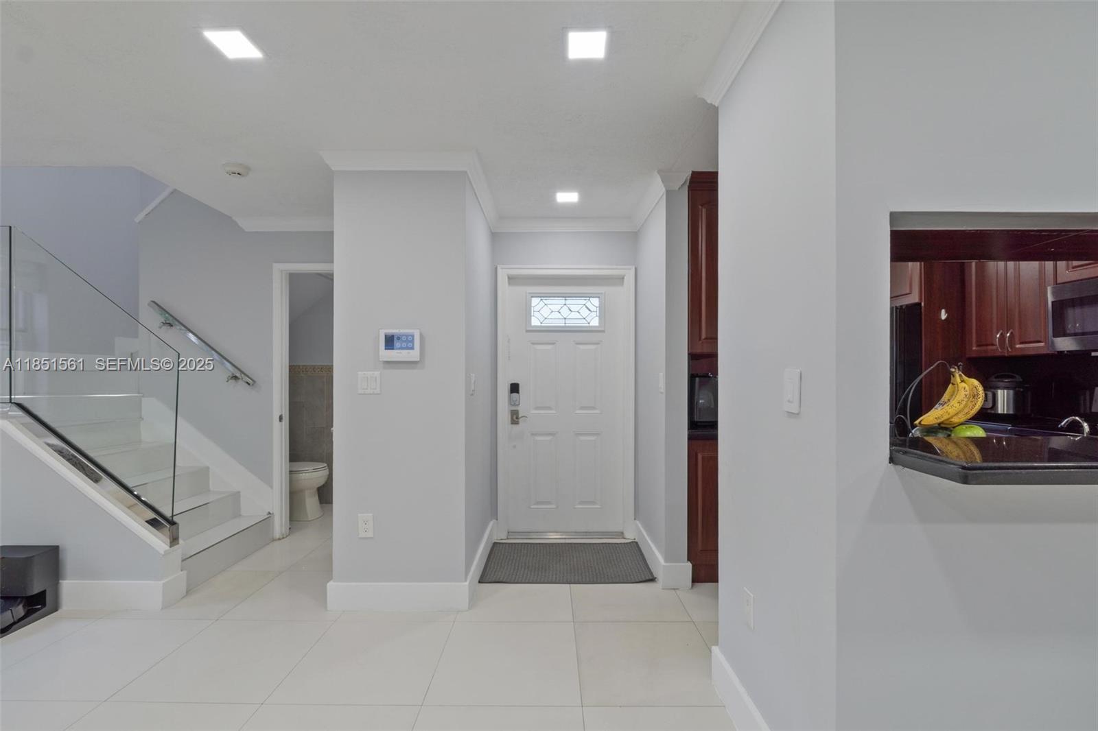 14725 Southwest 90th Terrace Miami, FL 33196 - Photo 14 of 50 a view of a hallway with closet and a couch