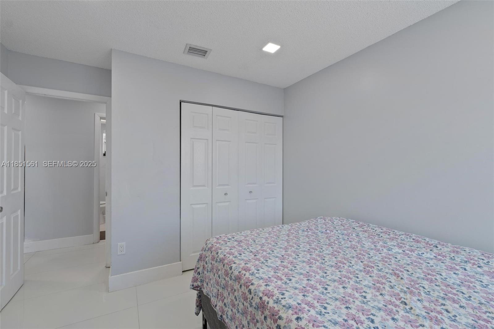 14725 Southwest 90th Terrace Miami, FL 33196 - Photo 25 of 50 a bedroom with a bed and a shower