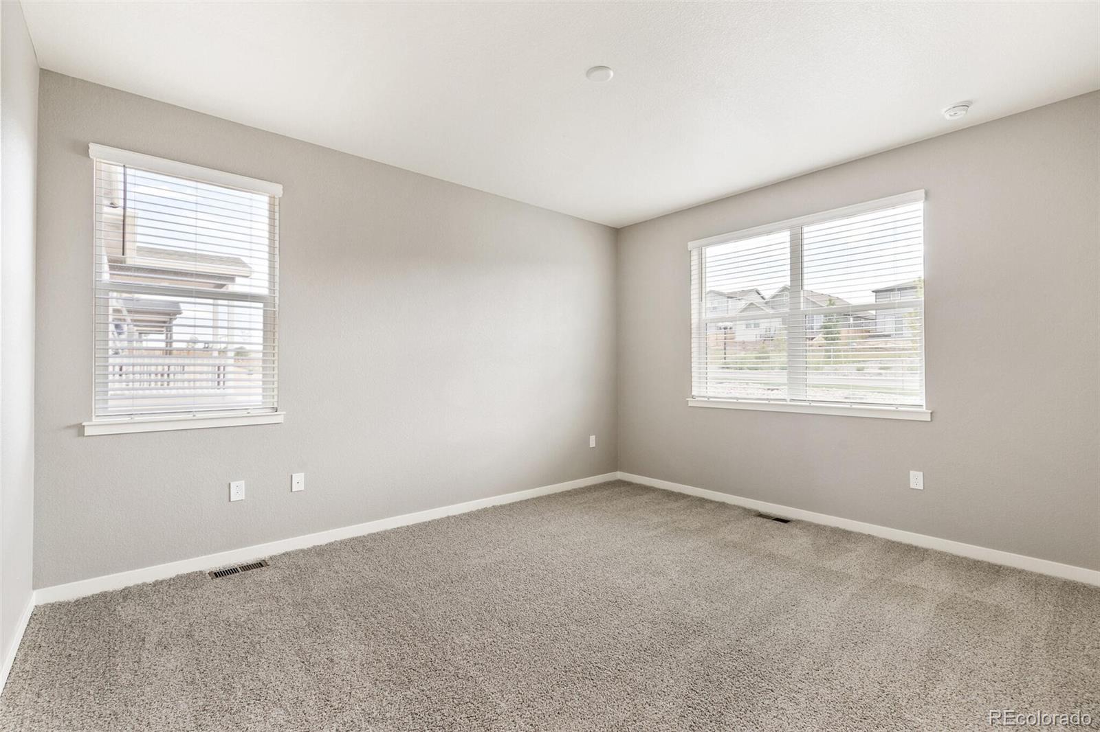 3458 Belleville Ridge Road Elizabeth, CO 80107 - Photo 17 of 27 an empty room with windows