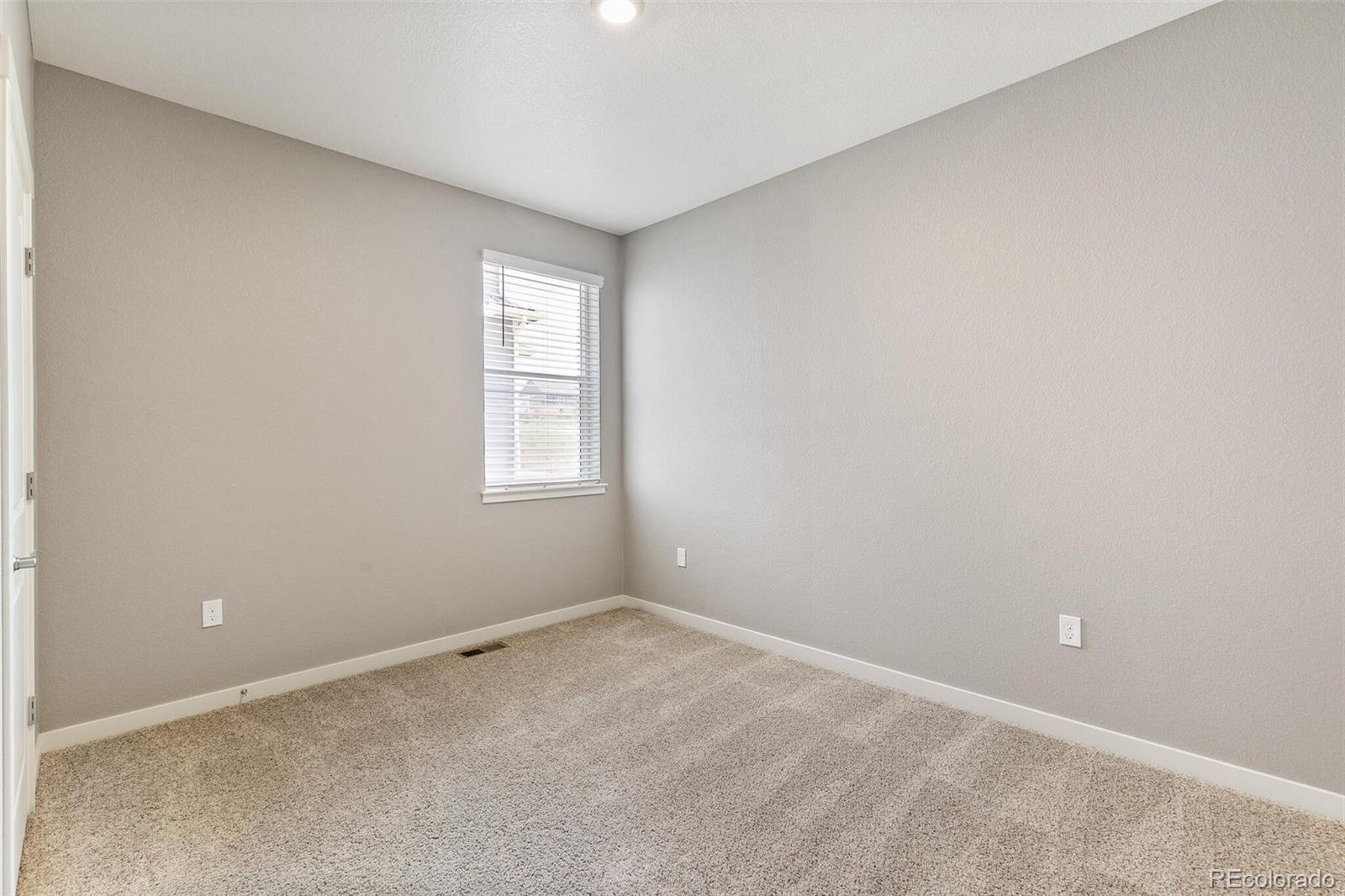3458 Belleville Ridge Road Elizabeth, CO 80107 - Photo 22 of 27 an empty room with windows