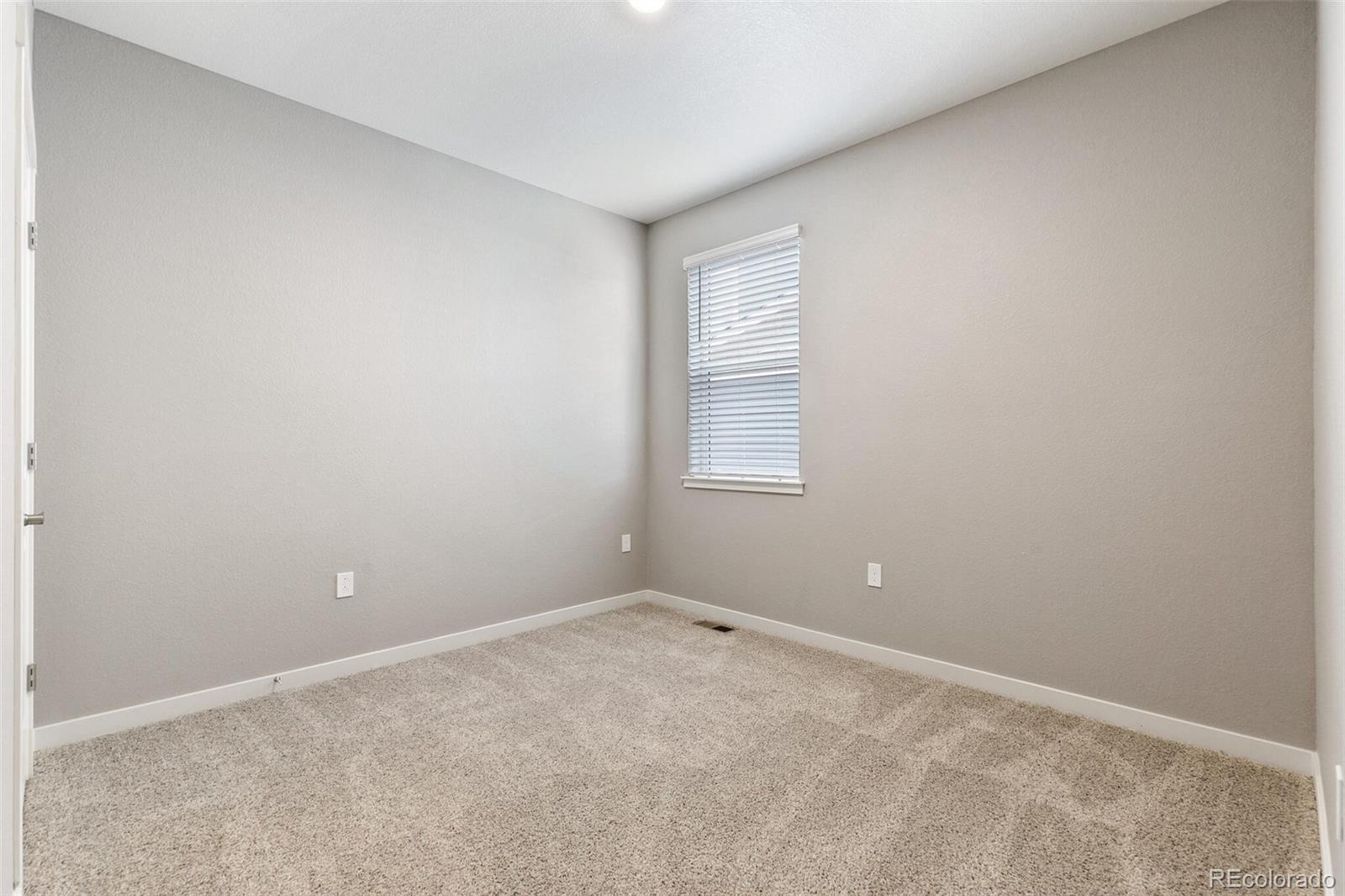 3458 Belleville Ridge Road Elizabeth, CO 80107 - Photo 24 of 27 an empty room with windows