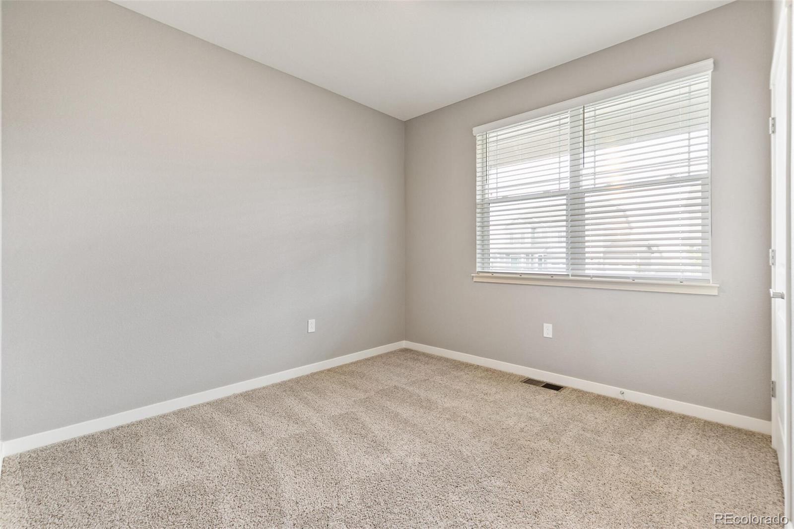 3458 Belleville Ridge Road Elizabeth, CO 80107 - Photo 25 of 27 an empty room with a window