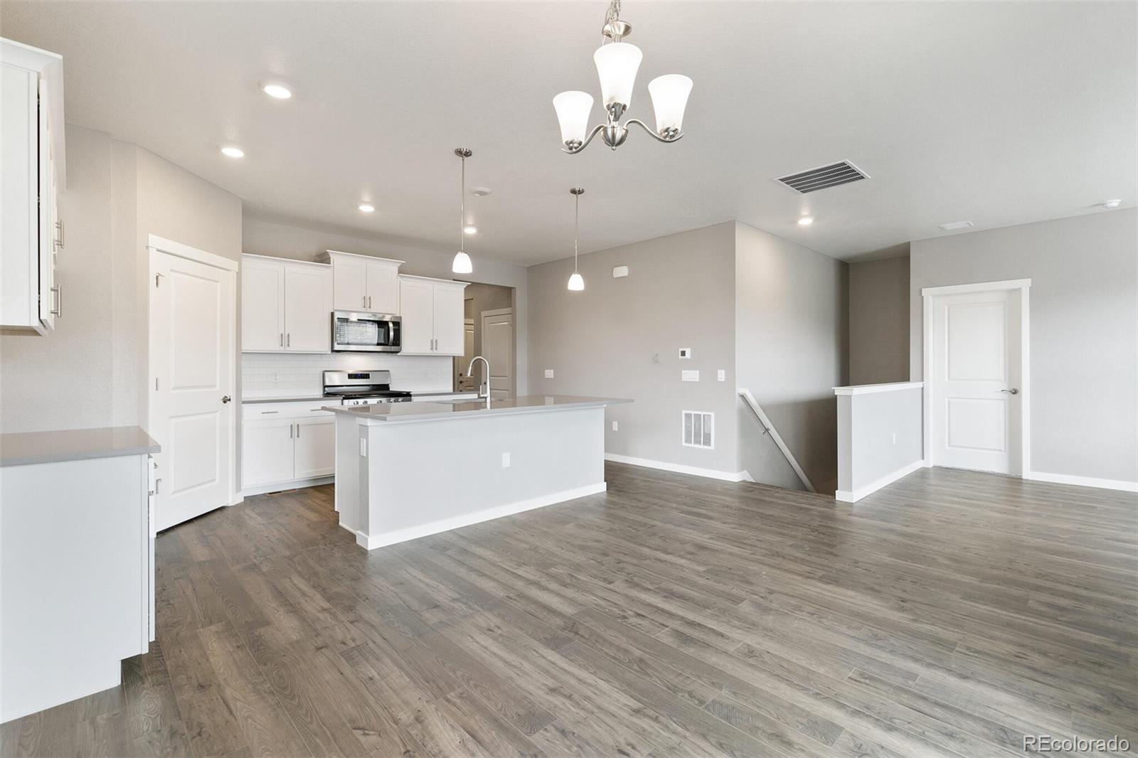 3458 Belleville Ridge Road Elizabeth, CO 80107 - Photo 8 of 27 a view of kitchen with granite countertop cabinets stainless steel appliances and a dining table
