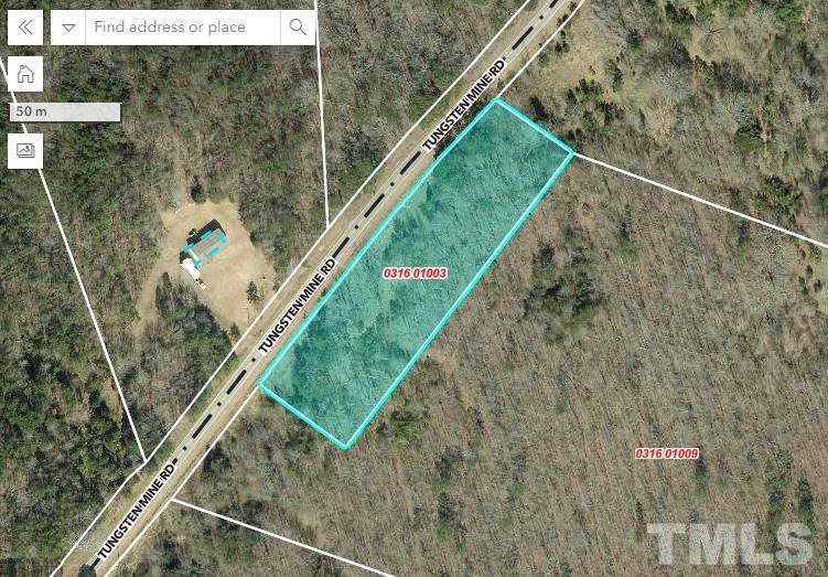 Tungsten Mine Road Bullock, NC 27507 - Photo 1 of 3 a view of a yard with a forest