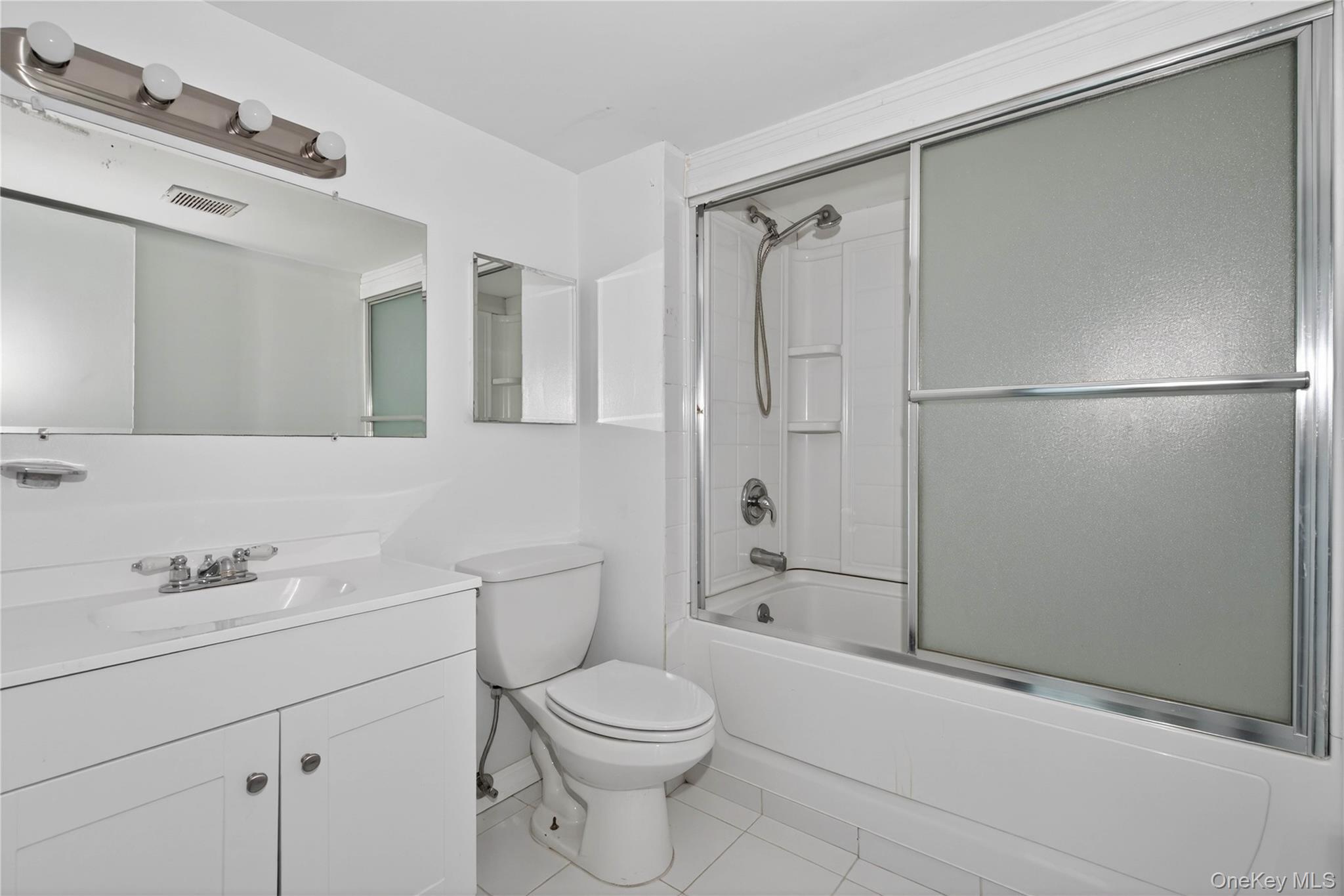 40 Felter Hill Road Monroe, NY 10950 - Photo 23 of 37 a bathroom with a shower sink vanity mirror and toilet