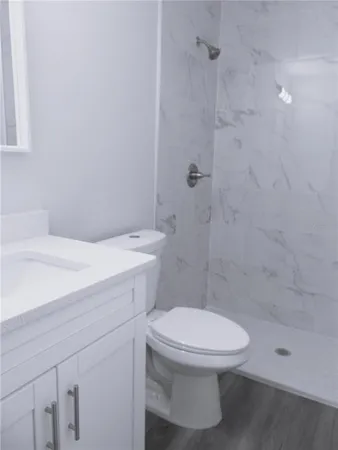 a bathroom with a sink toilet and bathtub