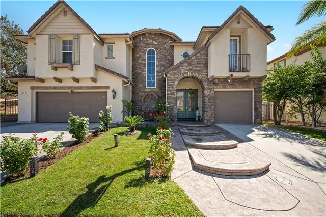 a view of a large tree in front of a house