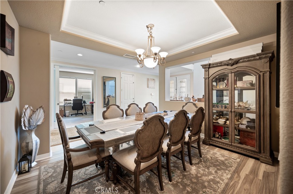 5588 California Oak Street Simi Valley, CA 93063 - Photo 22 of 75 a view of a dining room with furniture and wooden floor