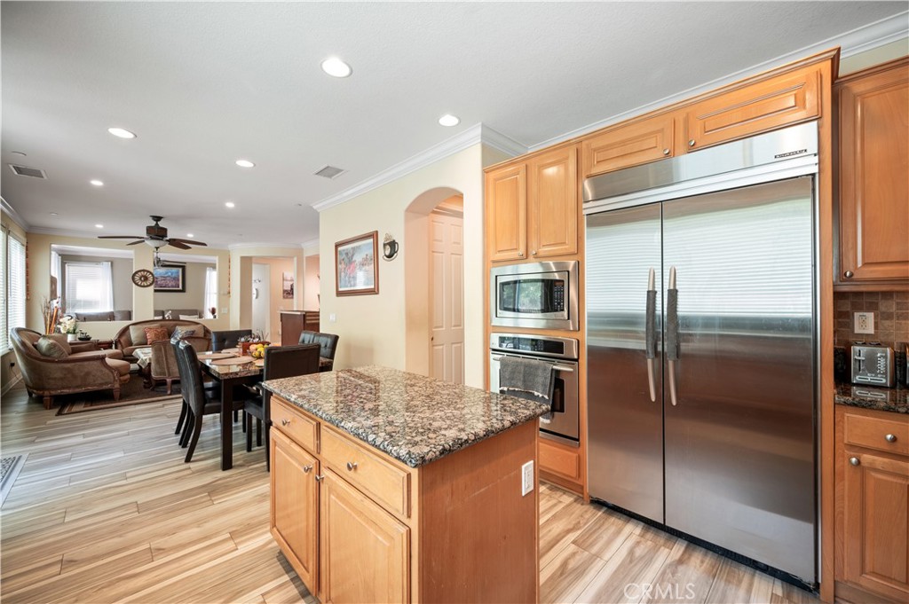 5588 California Oak Street Simi Valley, CA 93063 - Photo 29 of 75 a kitchen with stainless steel appliances granite countertop a refrigerator and a stove top oven