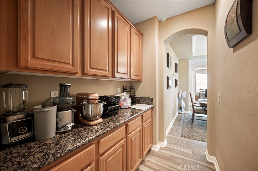 5588 California Oak Street Simi Valley, CA 93063 - Photo 32 of 75 a kitchen with stainless steel appliances granite countertop a sink stove and refrigerator