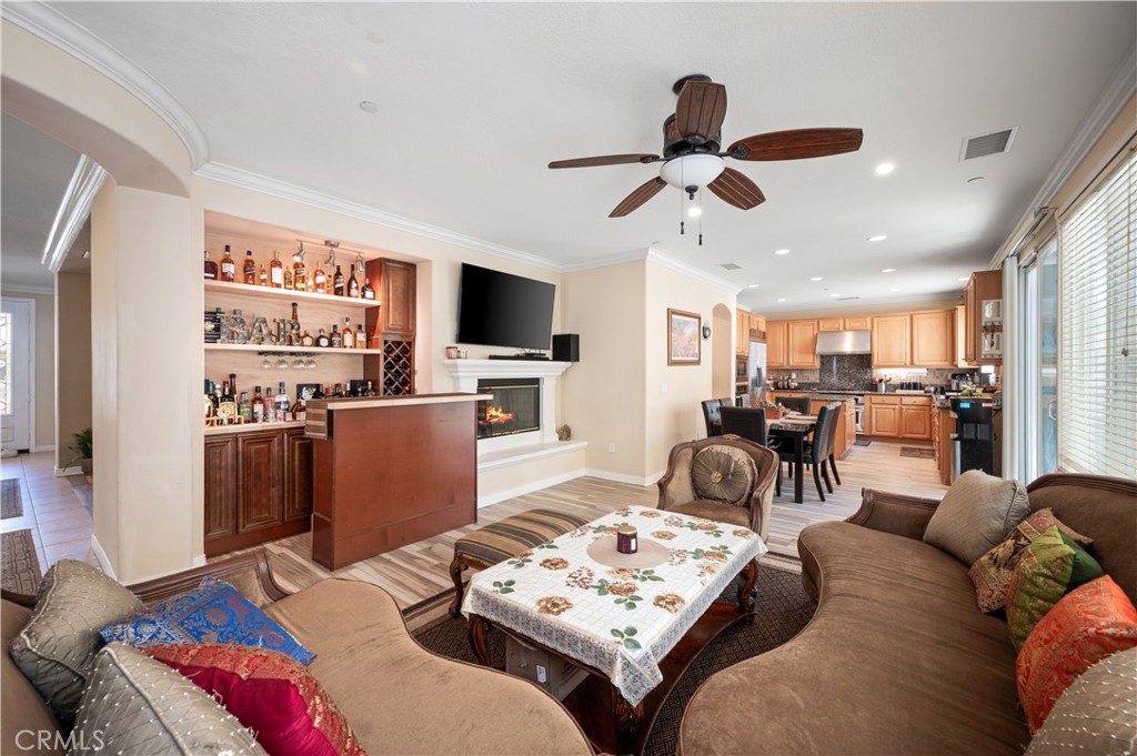 5588 California Oak Street Simi Valley, CA 93063 - Photo 34 of 75 a living room with furniture a flat screen tv and kitchen view