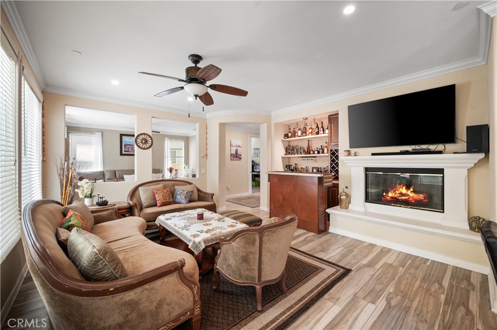 5588 California Oak Street Simi Valley, CA 93063 - Photo 37 of 75 a living room with furniture a flat screen tv and a fireplace