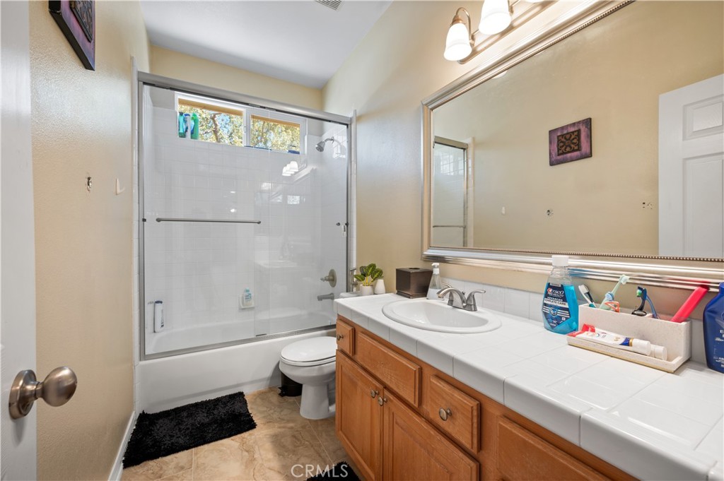5588 California Oak Street Simi Valley, CA 93063 - Photo 49 of 75 a bathroom with a sink a toilet and shower