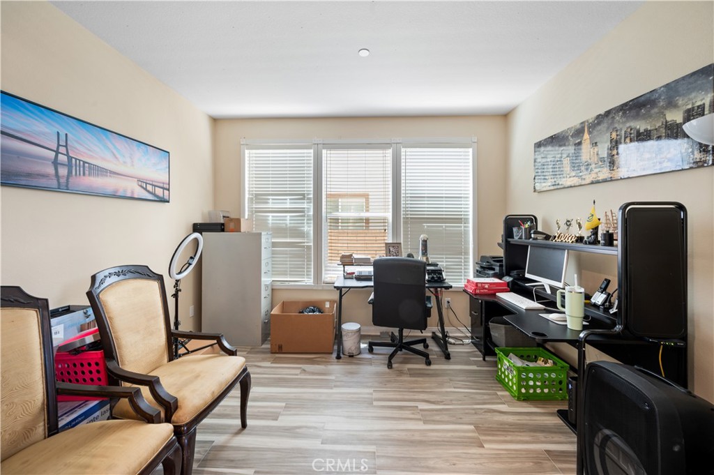 5588 California Oak Street Simi Valley, CA 93063 - Photo 62 of 75 a living room with furniture a flat screen tv and large windows