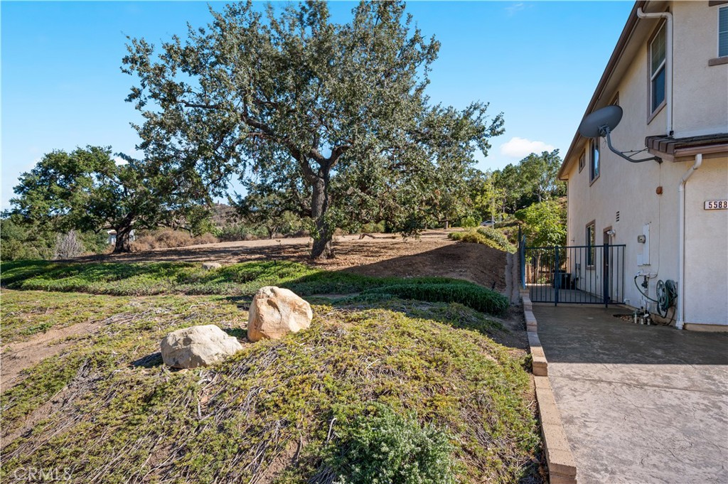 5588 California Oak Street Simi Valley, CA 93063 - Photo 67 of 75 a backyard of a house with a yard and outdoor seating