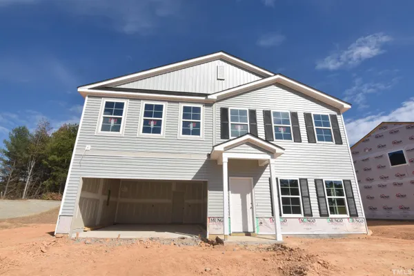 a front view of a house with a garage