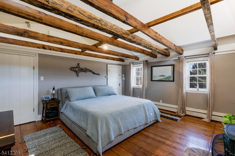 962 Old York Road Neshanic Station, NJ 08853 - Photo 19 of 33 a bedroom with a bed and wooden floor