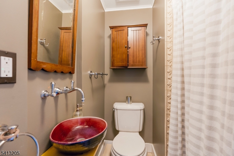 962 Old York Road Neshanic Station, NJ 08853 - Photo 22 of 33 a bathroom with a toilet a sink and a mirror