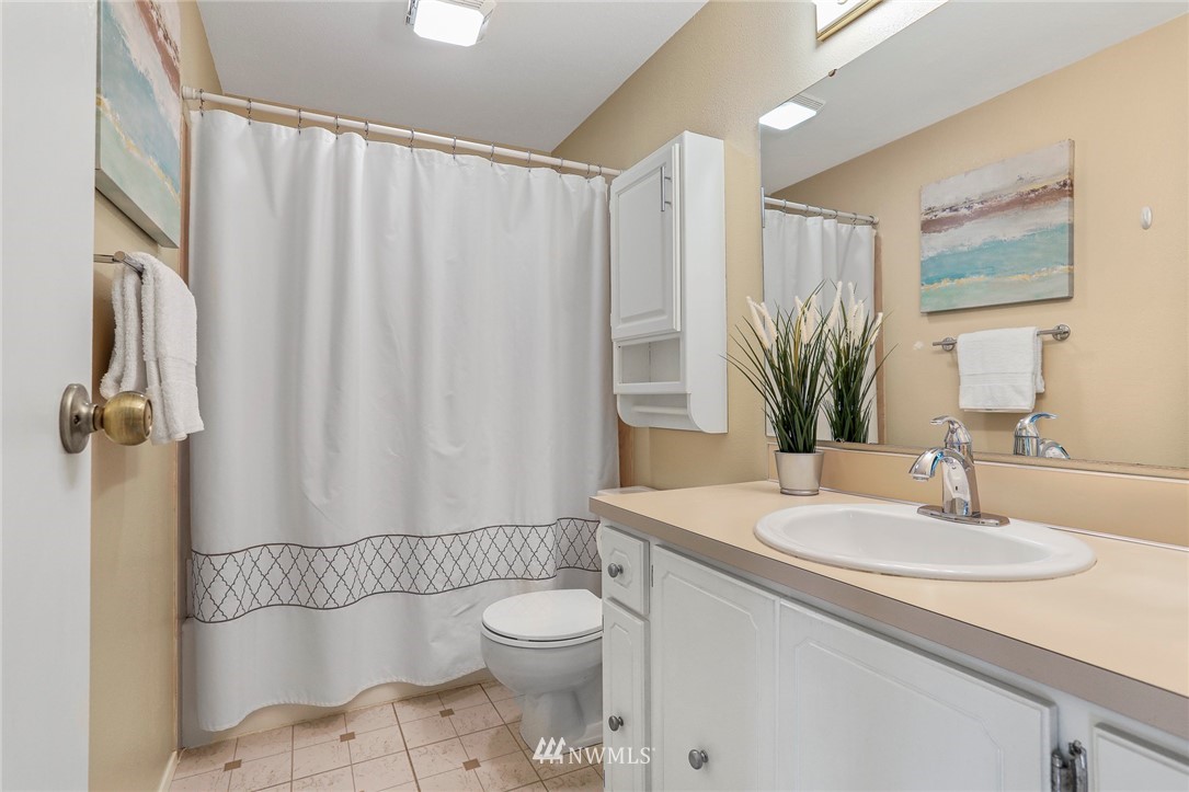 21529 4th Avenue West, Unit C34 Bothell, WA 98021 - Photo 14 of 26 a bathroom with a sink toilet and shower