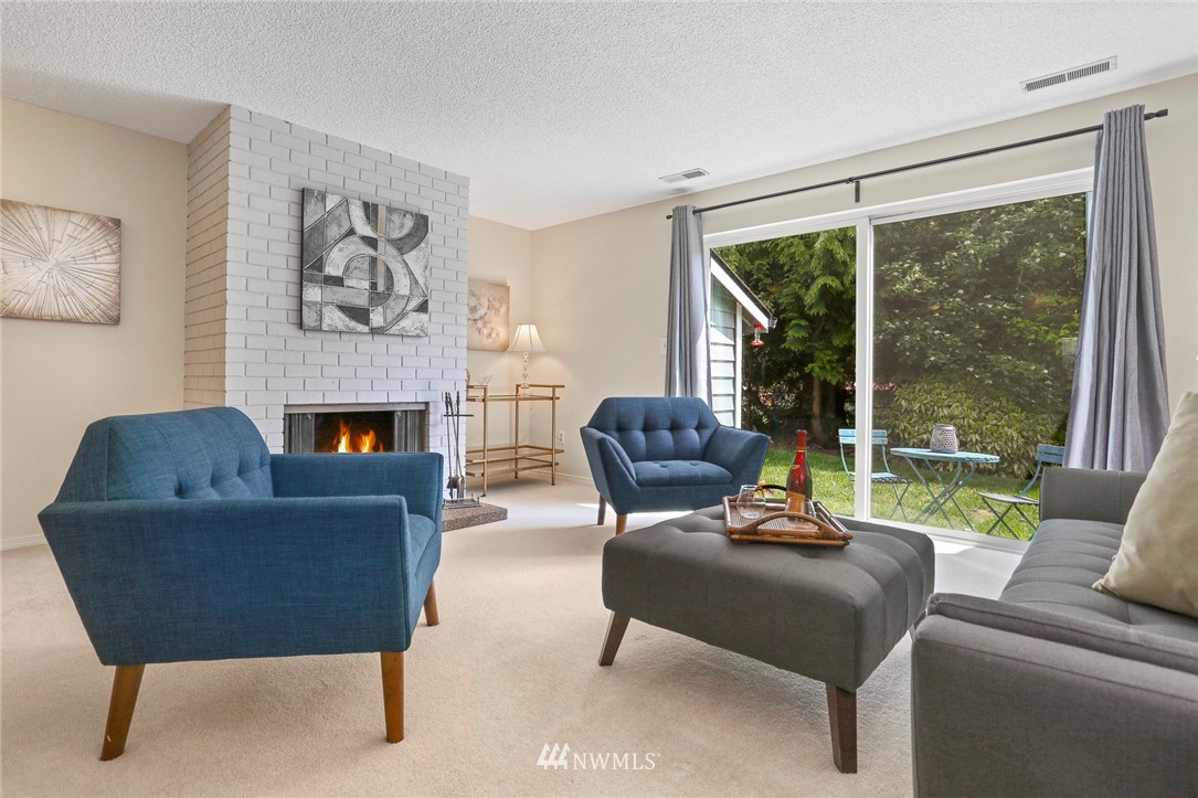 21529 4th Avenue West, Unit C34 Bothell, WA 98021 - Photo 8 of 26 a living room with furniture and a fireplace