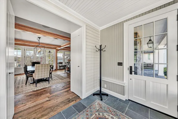 a kitchen with stainless steel appliances a stove and white cabinets