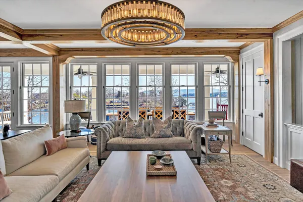 a bedroom with a large bed couch and a window