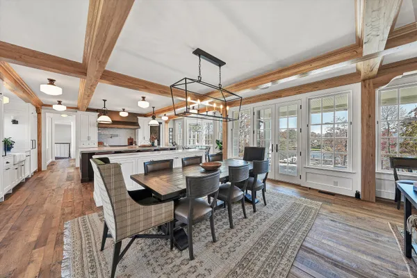 a bathroom with a sink a mirror and next to a window