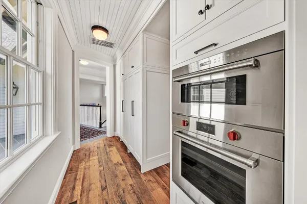 a en suite bathroom with a granite countertop sink mirror and a shower