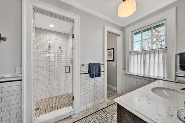 a roof deck with table and chairs a barbeque with wooden floor and fence