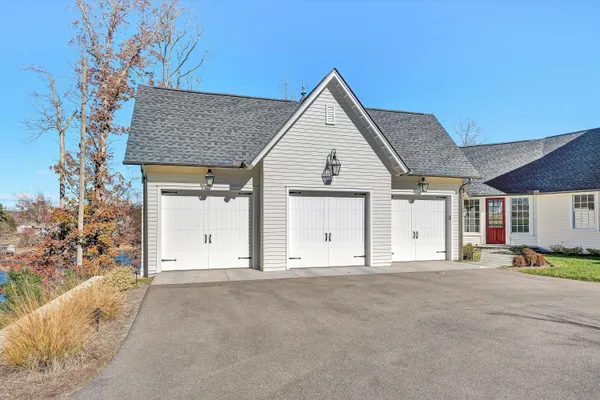 an aerial view of a house with a yard swimming pool outdoor seating and yard