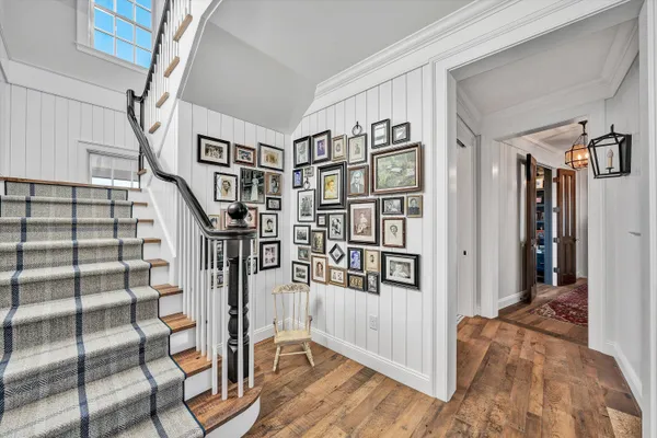 an aerial view of a house with a lake view