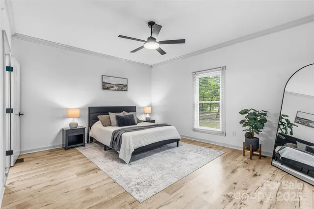 a bed room with a bed and a chair