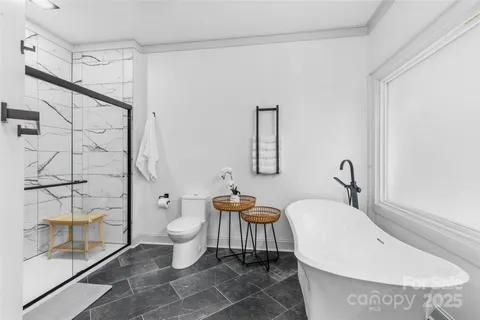 a bathroom with a toilet sink and shower