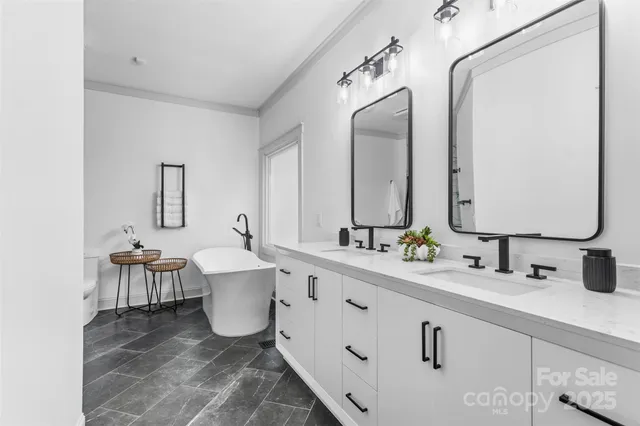 a bathroom with a double vanity sink and a mirror