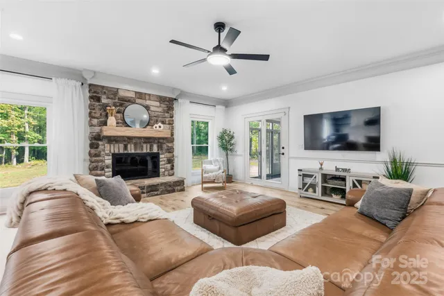 a living room with furniture fireplace and a flat screen tv