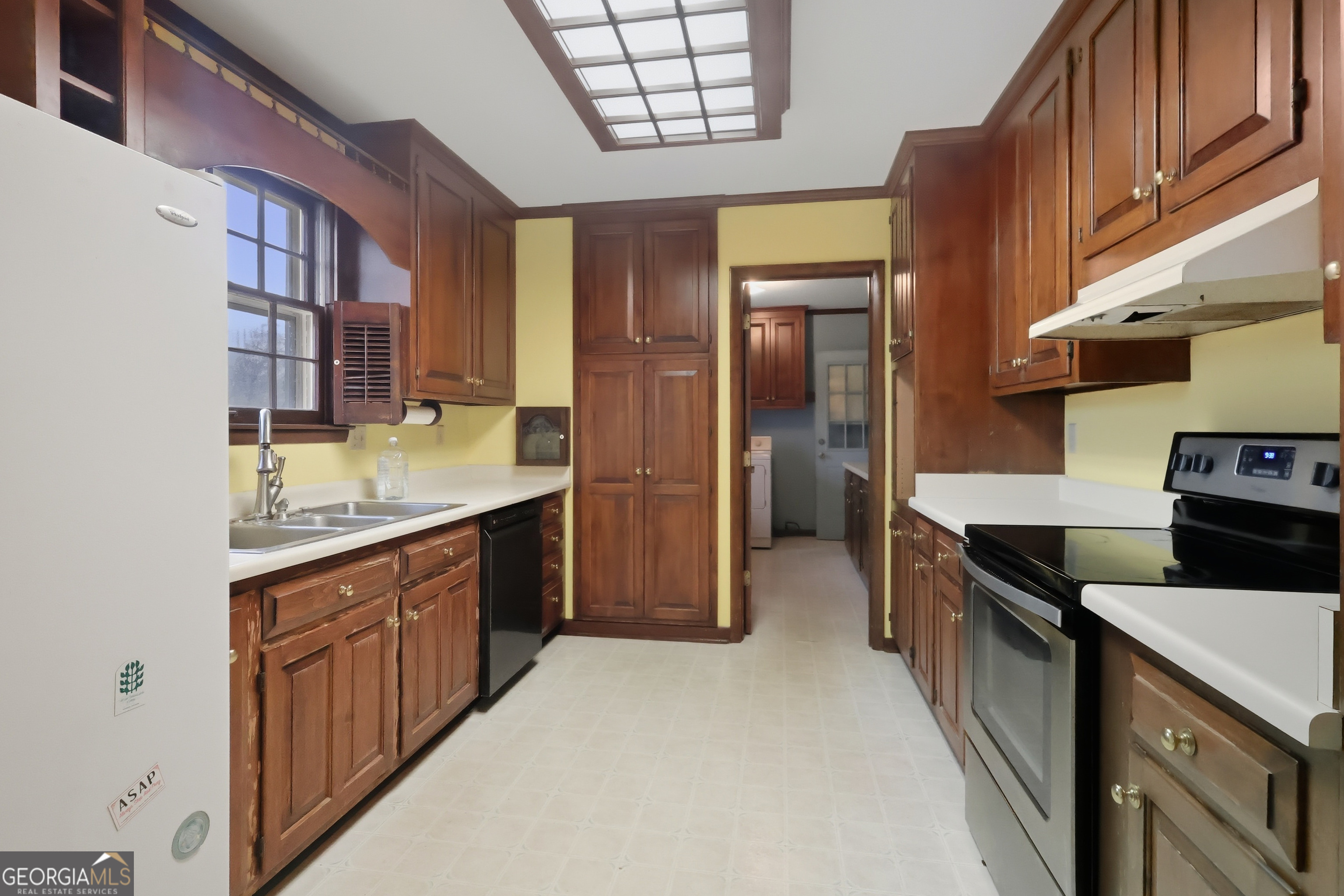 41 Brooks Street Royston, GA 30662 - Photo 11 of 44 a kitchen with a sink stove and cabinets