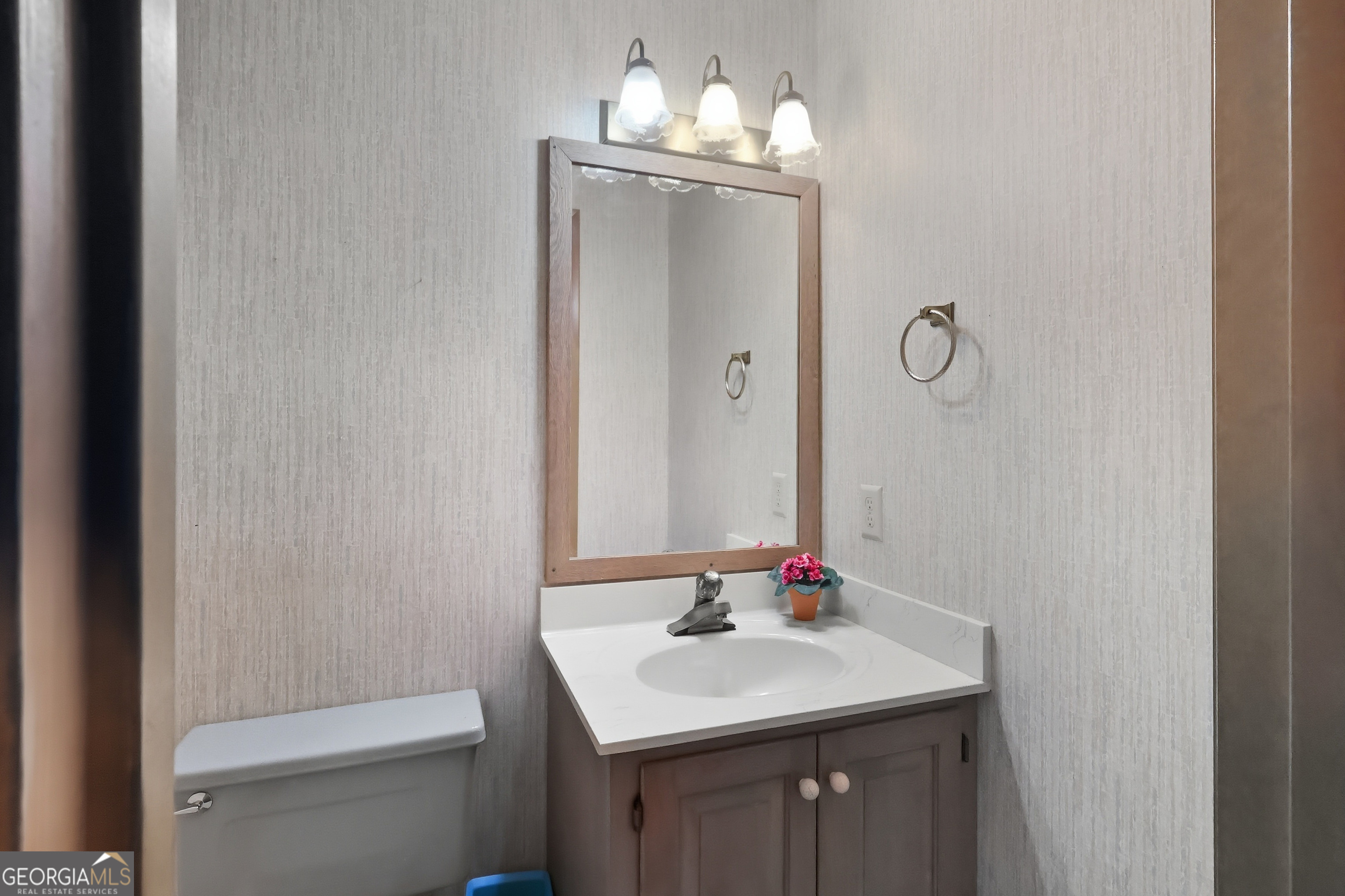 41 Brooks Street Royston, GA 30662 - Photo 15 of 44 a bathroom with a sink toilet and mirror